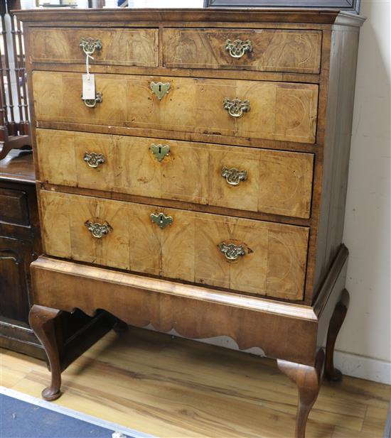 A George III walnut chest on later stand W.96cm
